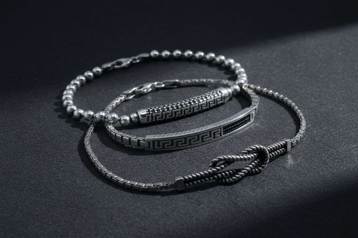 Three Silver Bracelets on Charcoal